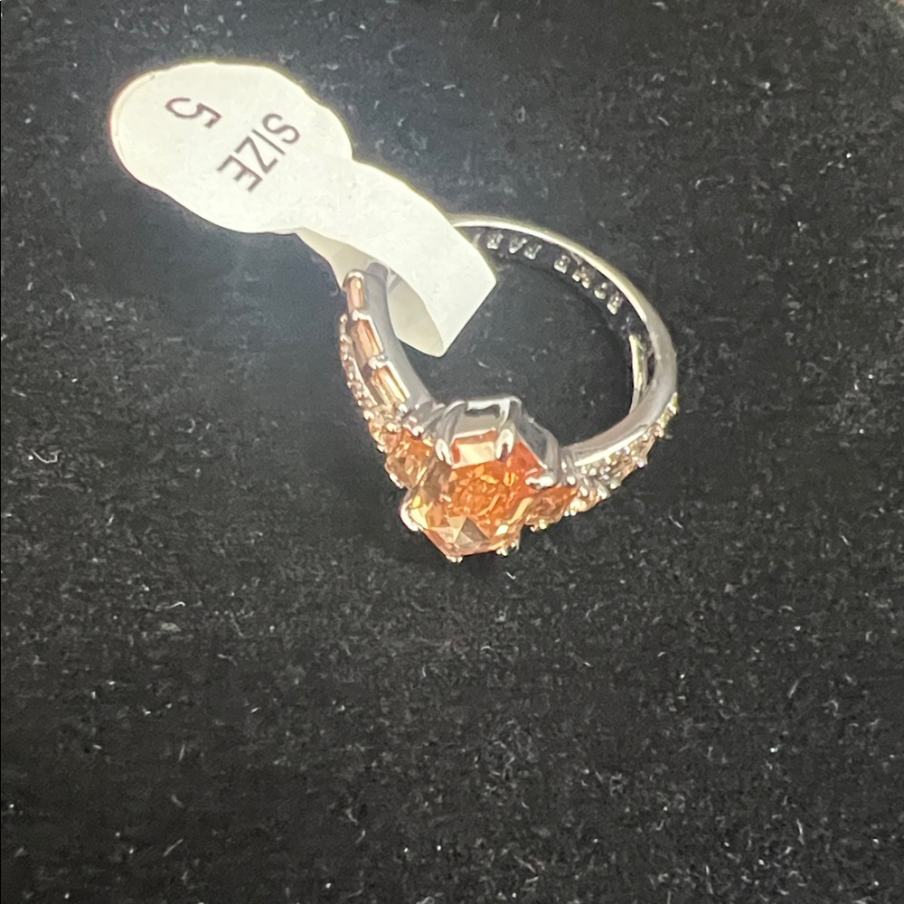 Radiant Silver Ring With Orange Gemstone - image 1